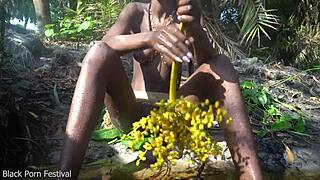 Look at this tribe girl with perfect tits making medicine in the jungle.